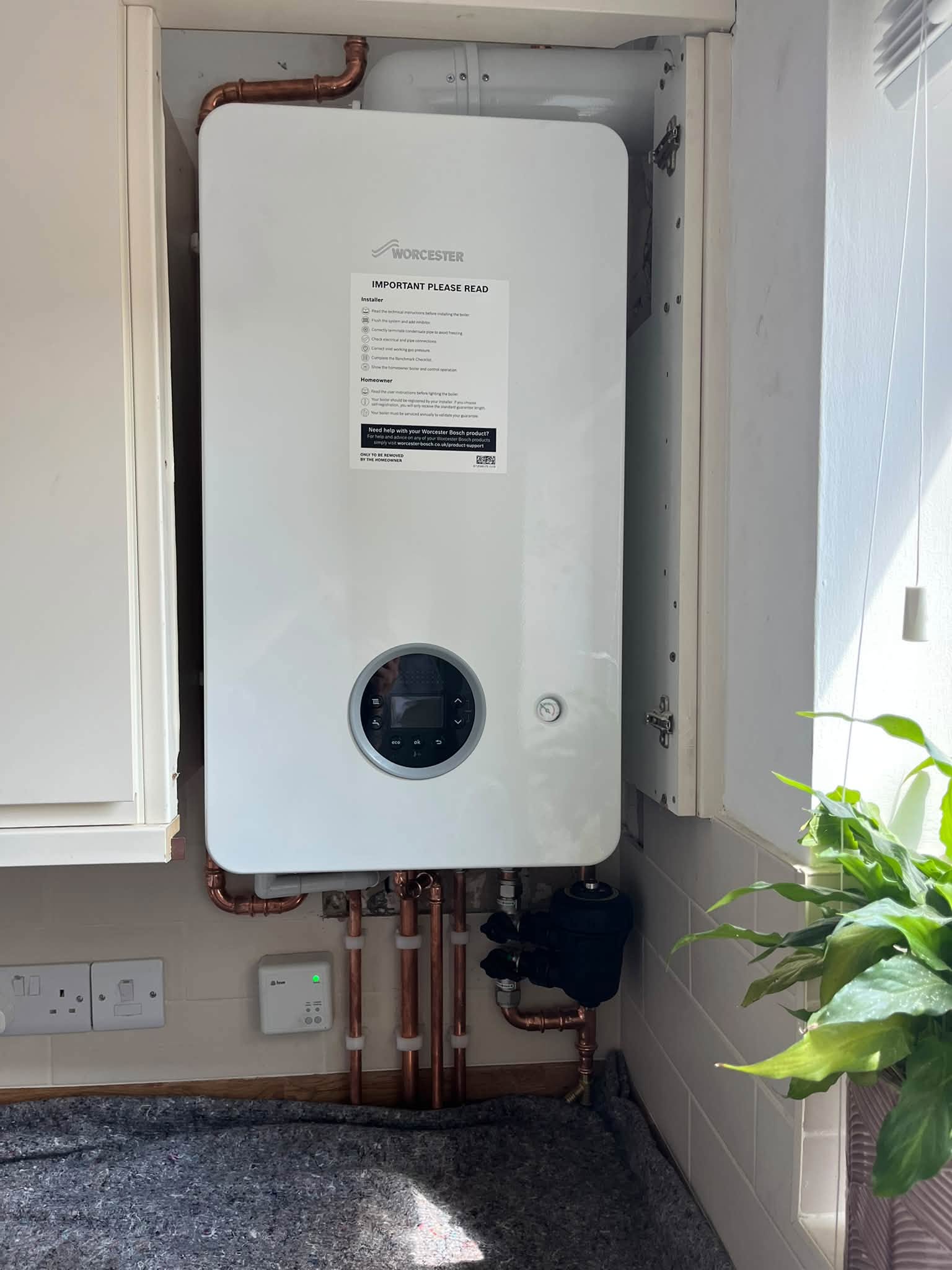New Worcester Bosch combi boiler installed in a kitchen